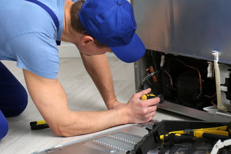 img of someone working on an appliance